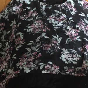 A black pink and white flower shirt